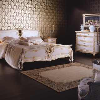 Classic bedroom Luigi XVI style, classic king size bed, night tables, carved chest of drawers. White over gold finish