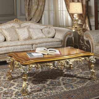 Classic two seater sofa, fabric finish, with carved and golden details and cymatium. Classic table with gold and silver leaf carvings