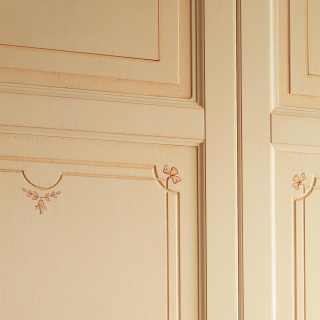 Classic modular wardrobe: detail of carvings, flower decorations and anticated finish