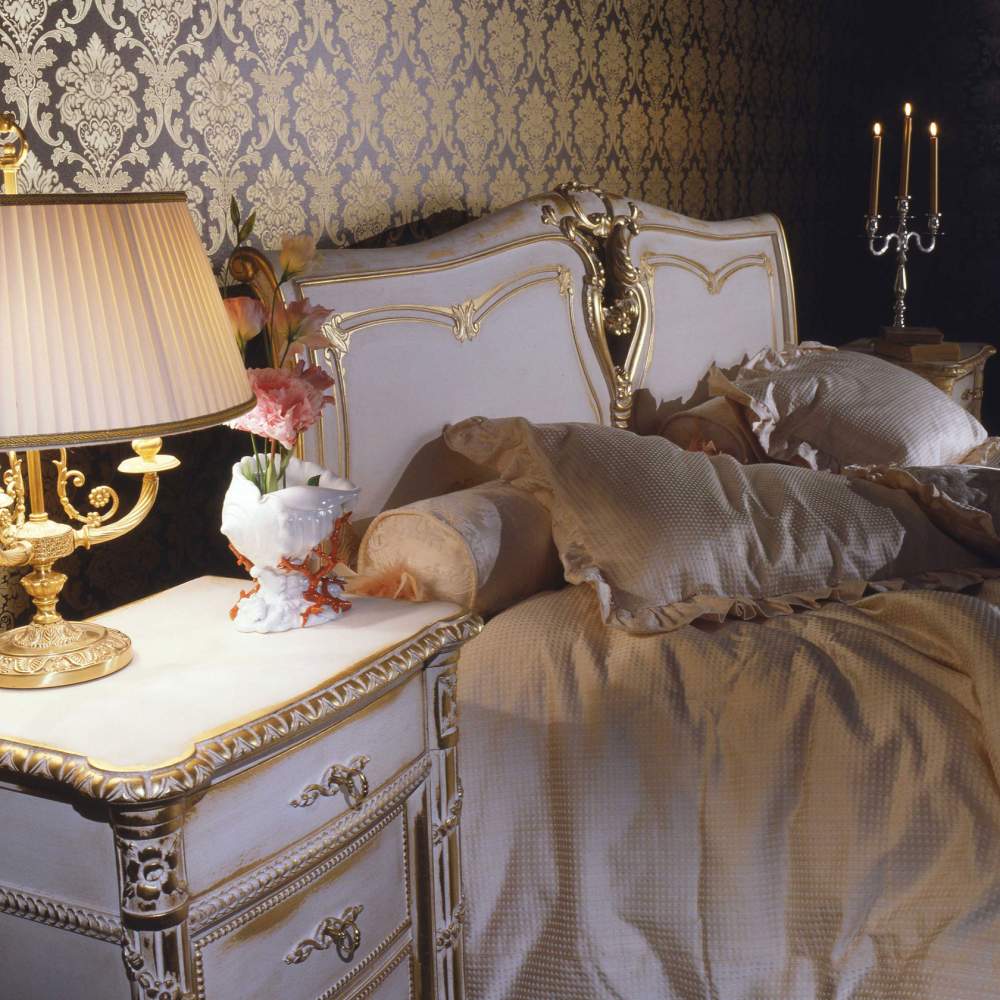 Classic Louis XVI bedroom, bed with carved headboard, carved night table, matching sheets